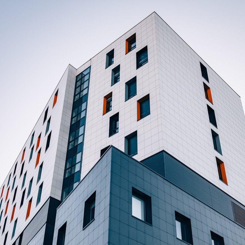blue and white building across sky